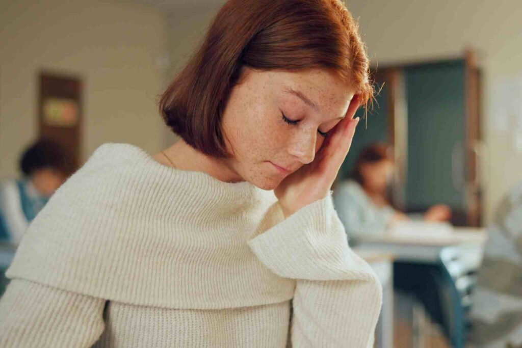 Young woman appearing emotionally overwhelmed during a depression self-assessment