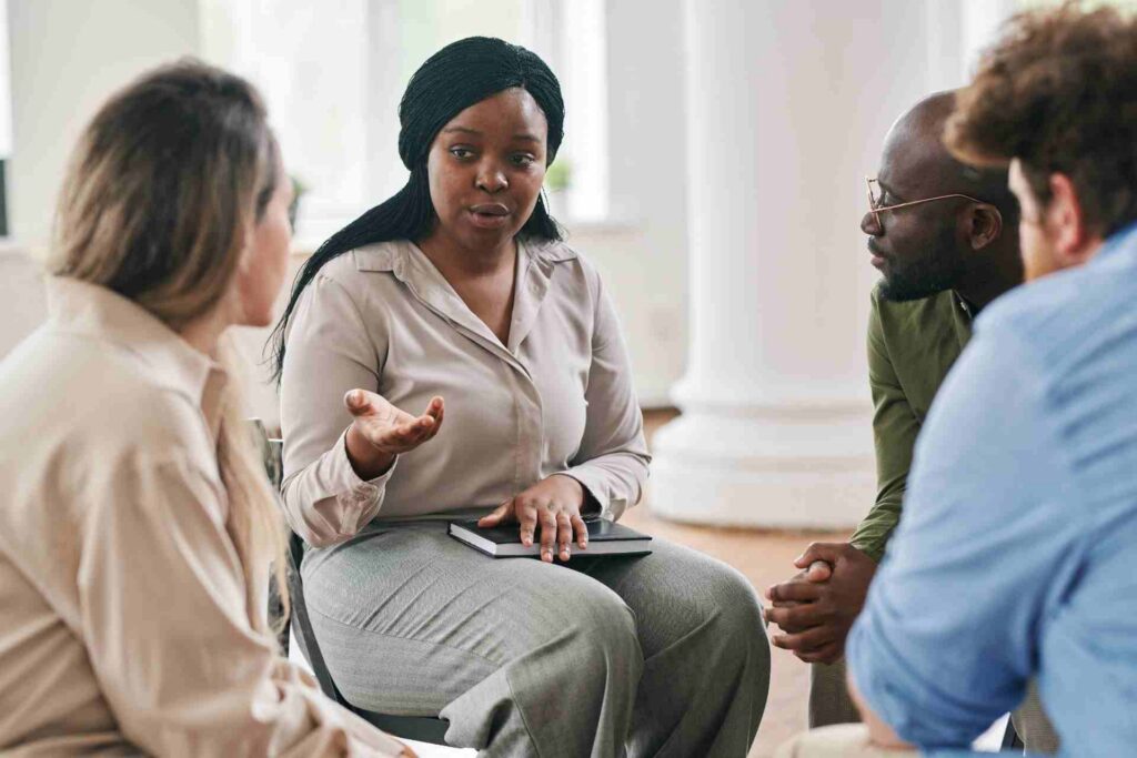 Mental health group therapy session for professionals and executives receiving confidential support