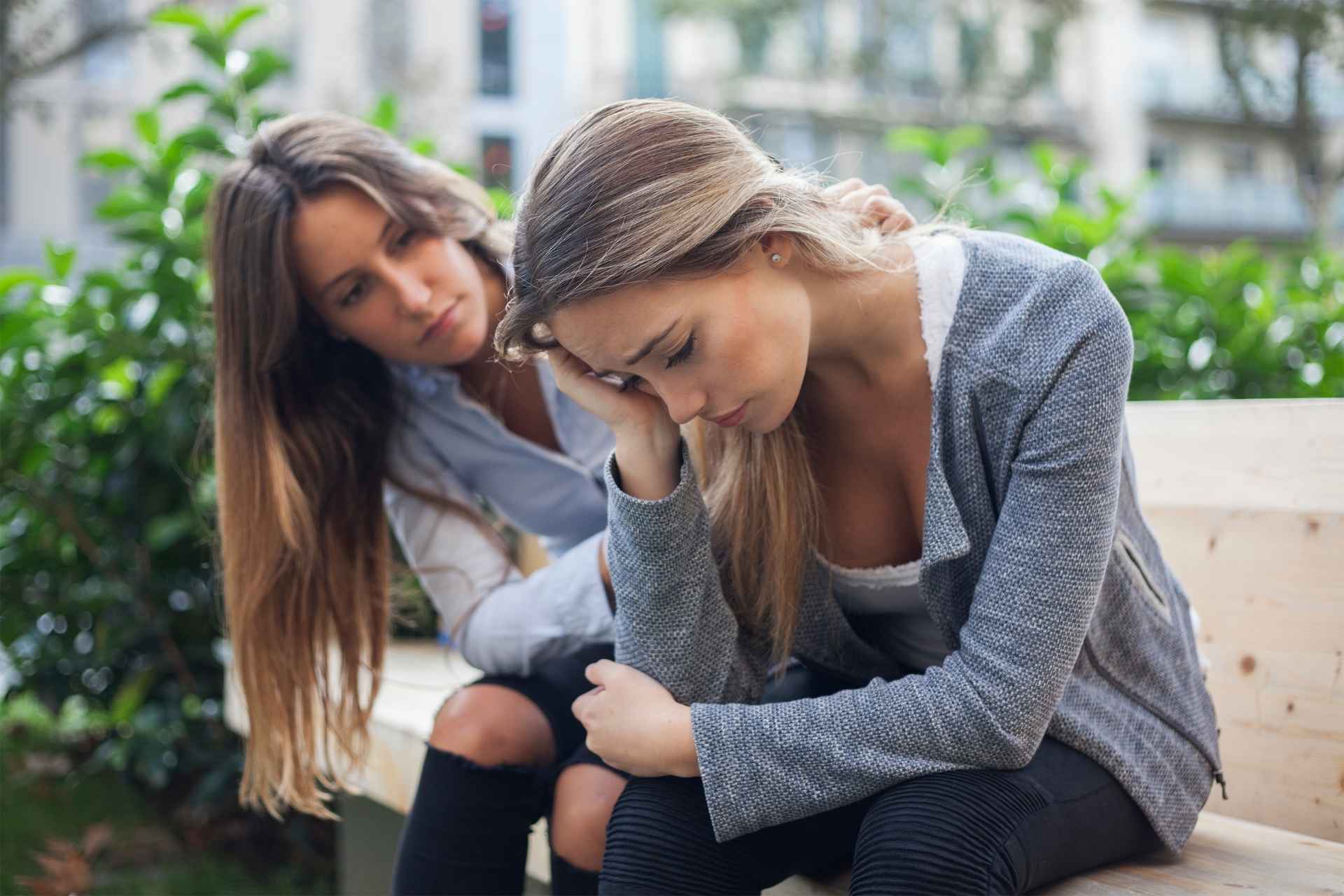 Friend offering compassionate support to a woman experiencing depression.