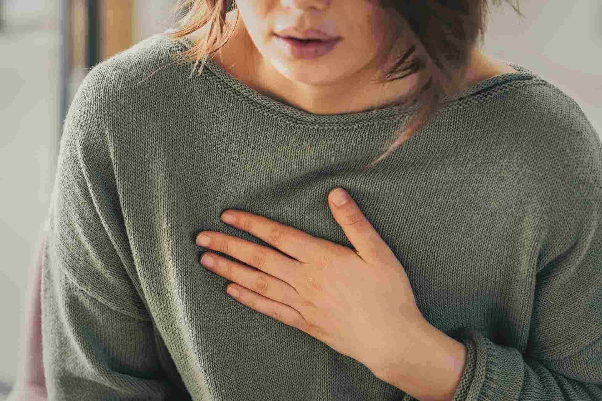 Person experiencing overwhelming panic attack symptoms.